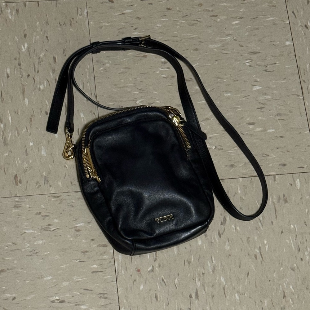 Tumi Black Crossbody Bag with Gold Accents